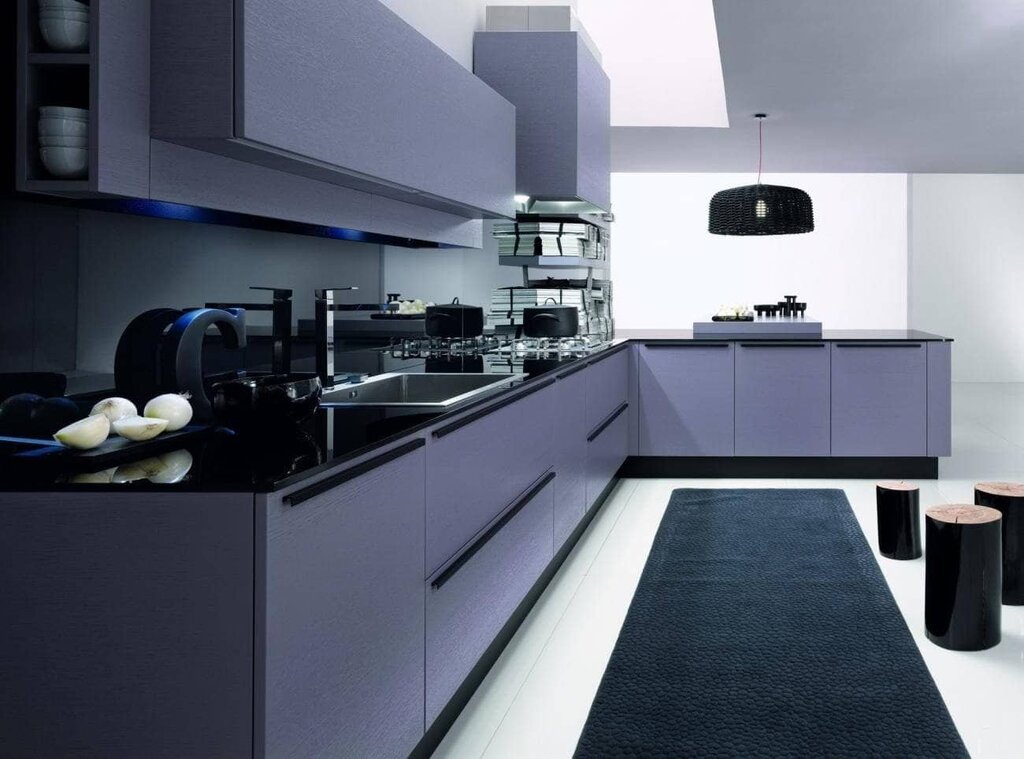 A kitchen with a black countertop