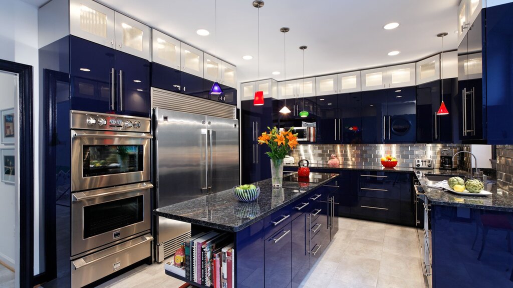 A kitchen with black appliances