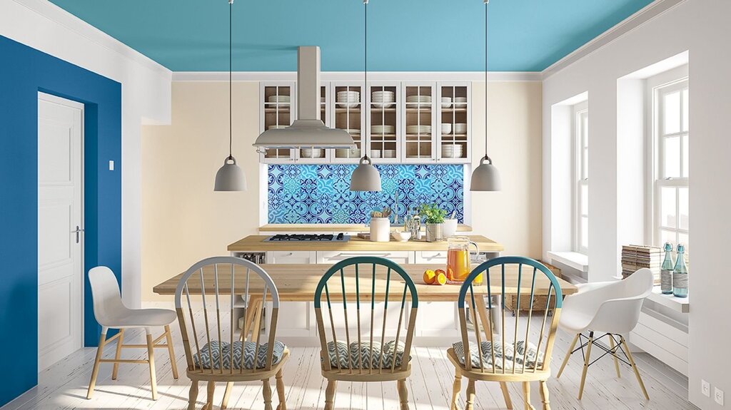 A kitchen with blue walls