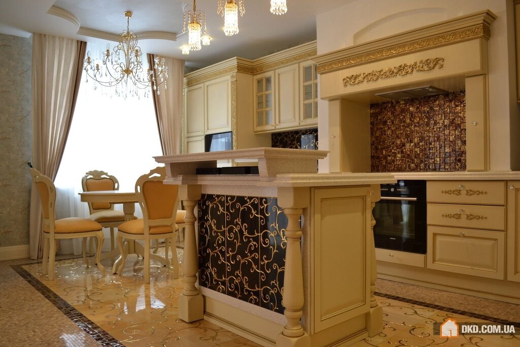 A kitchen with columns on the sides