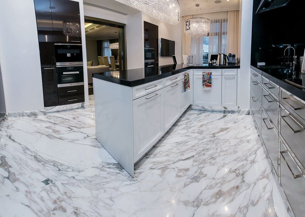 A kitchen with marble tiles on the floor