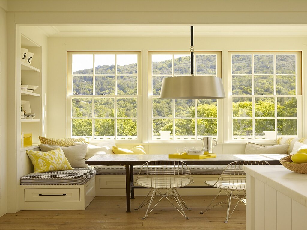 A kitchen with a low window