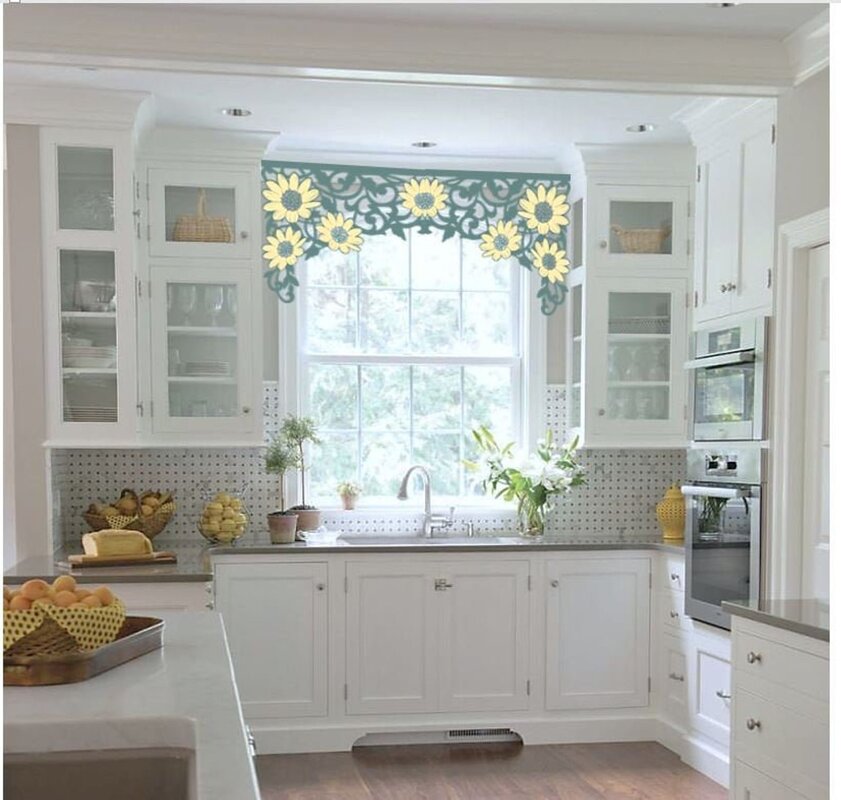 A kitchen with a window in the middle