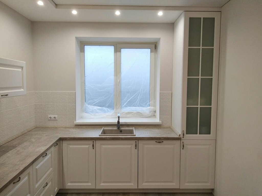 A kitchen with a window in the work area