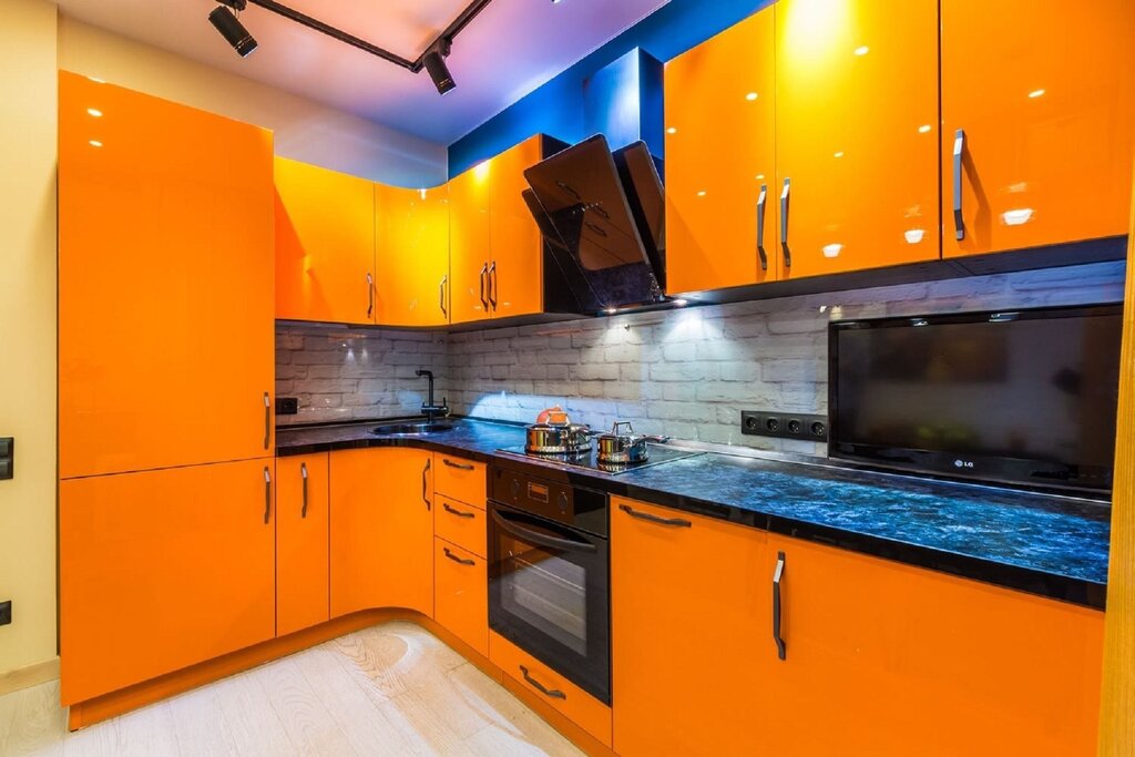 Kitchen with an orange set