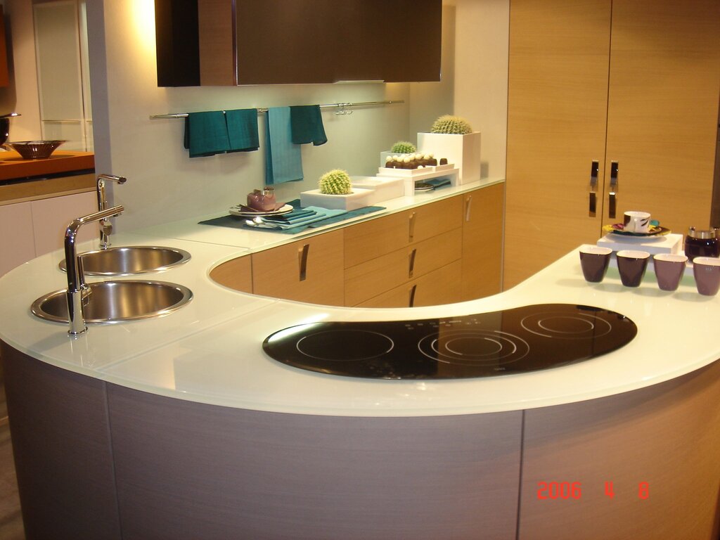 A kitchen with rounded fronts