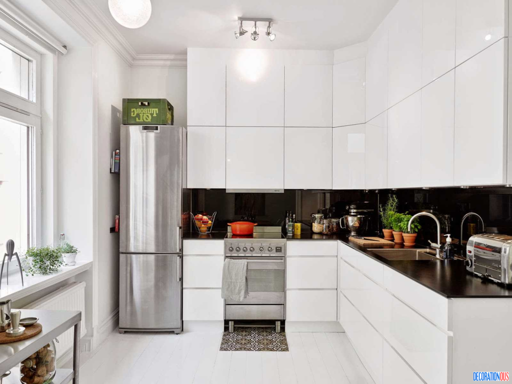 A kitchen with a silver refrigerator