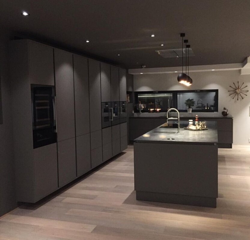 A kitchen with a dark floor