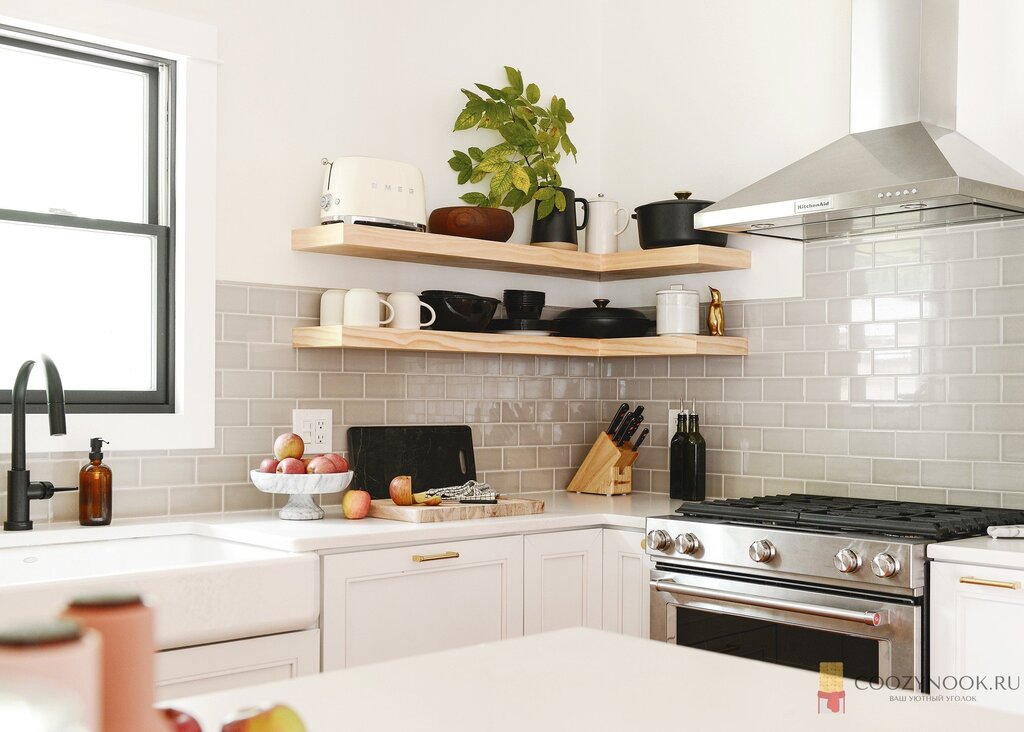 A kitchen with an exhaust hood without upper cabinets