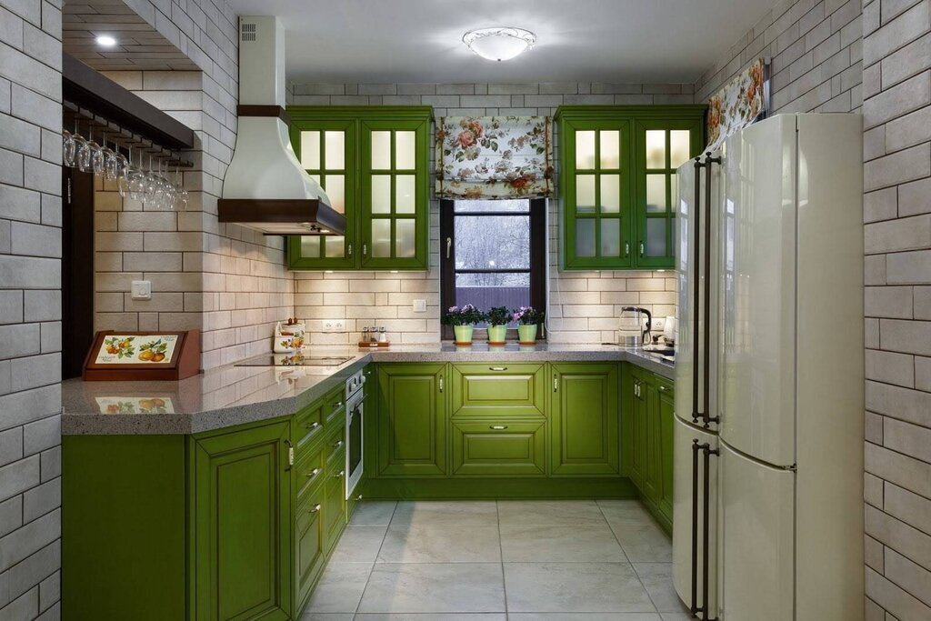 A kitchen with green facades