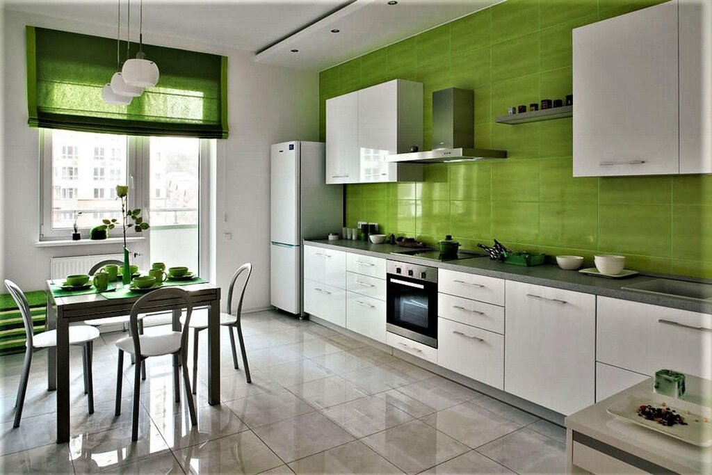 The kitchen is light green with white