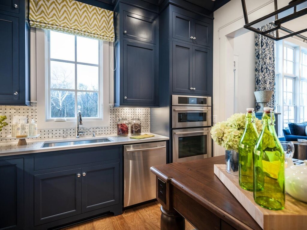 The kitchen is in dark blue color