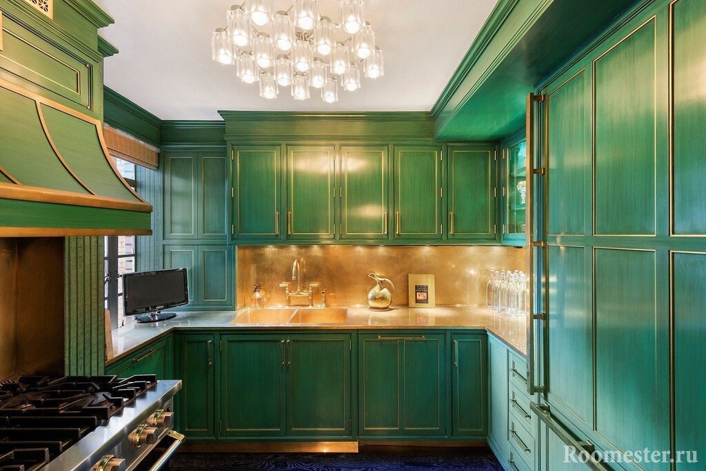 The kitchen in dark green tones