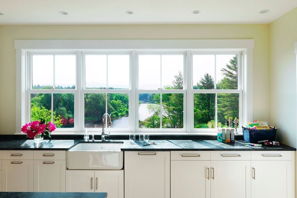 A kitchen along the wall with a window