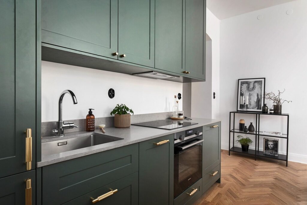 The kitchen is green with gray