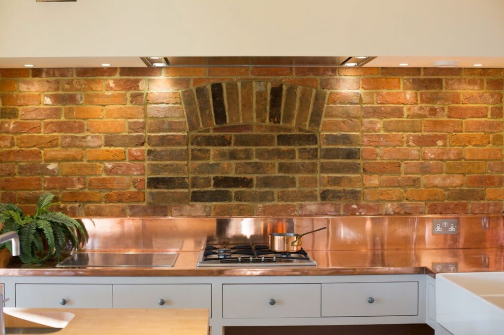 A copper kitchen apron