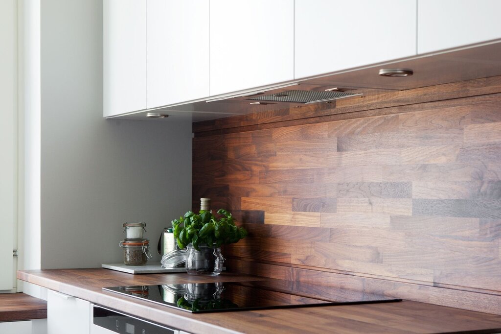 A kitchen backsplash on the wall made of laminate