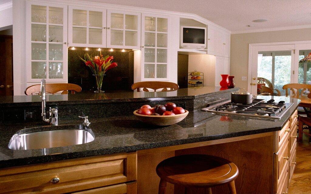 Kitchen island with a stove and sink