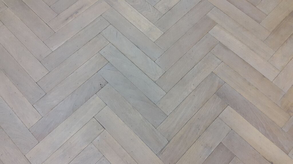 Linoleum with herringbone parquet pattern