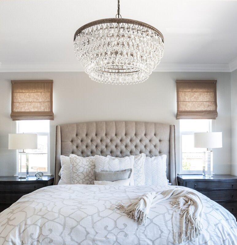 Chandelier above the bed