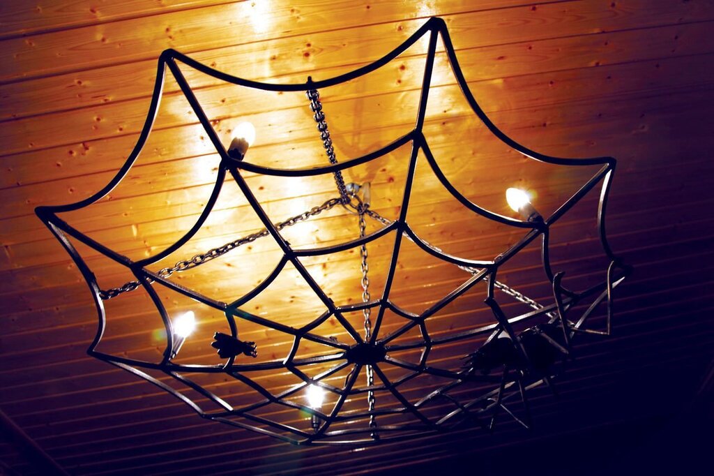 A chandelier in the form of a spider web