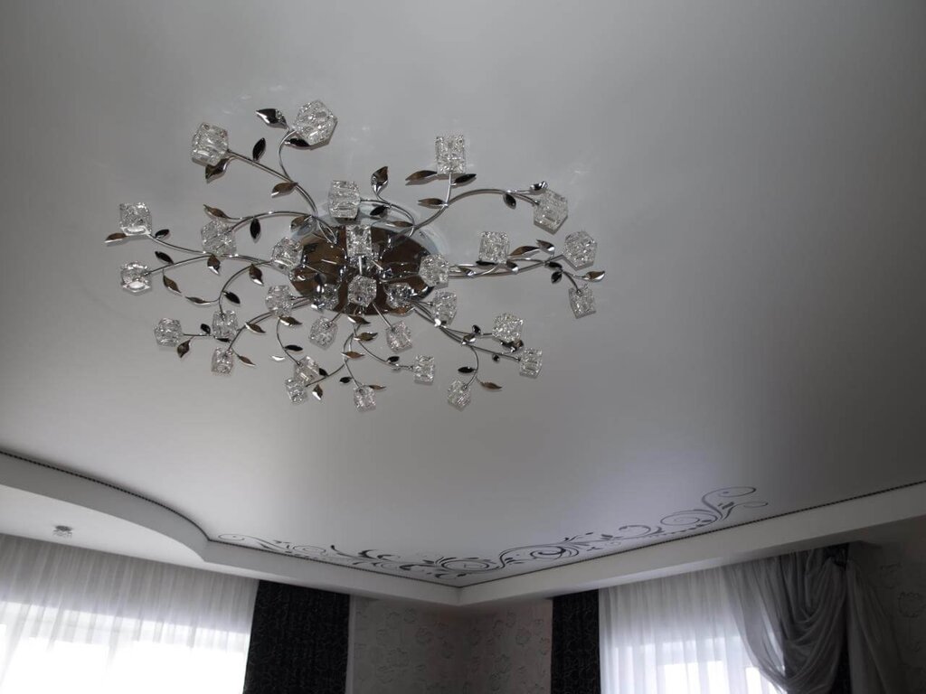 A chandelier for the living room on a stretch ceiling