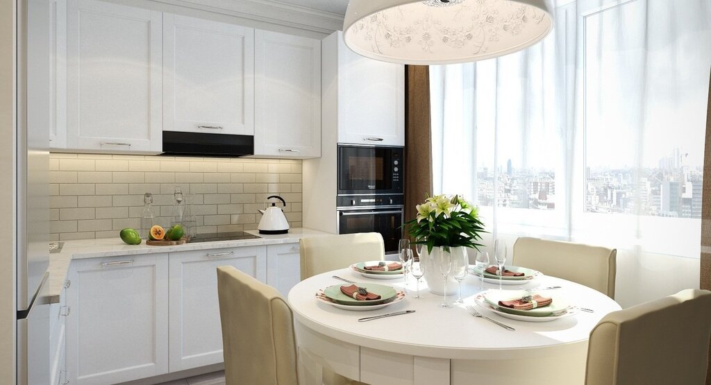 A small kitchen with a round table