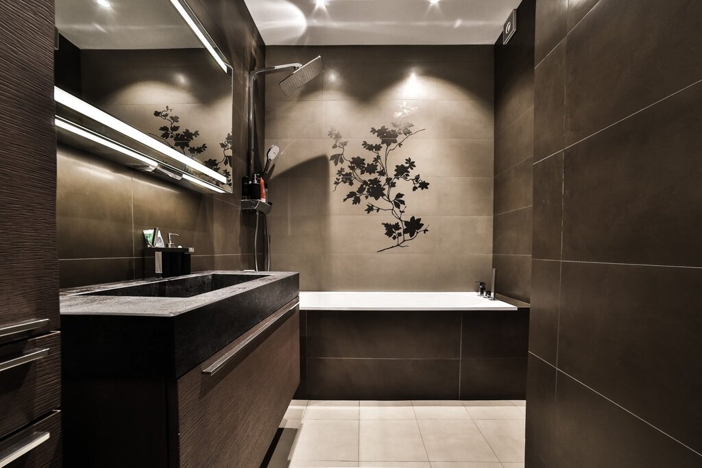 A small bathroom in dark tones