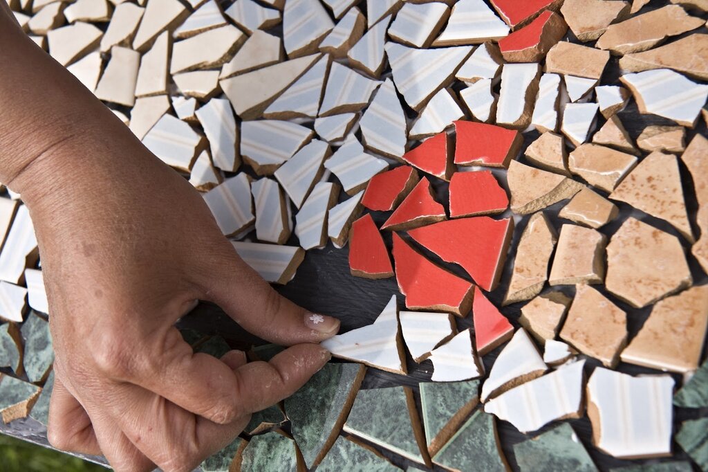 Mosaic of broken tiles on the floor