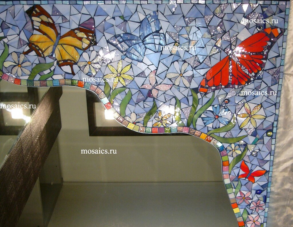 Mosaic of broken tiles on the wall