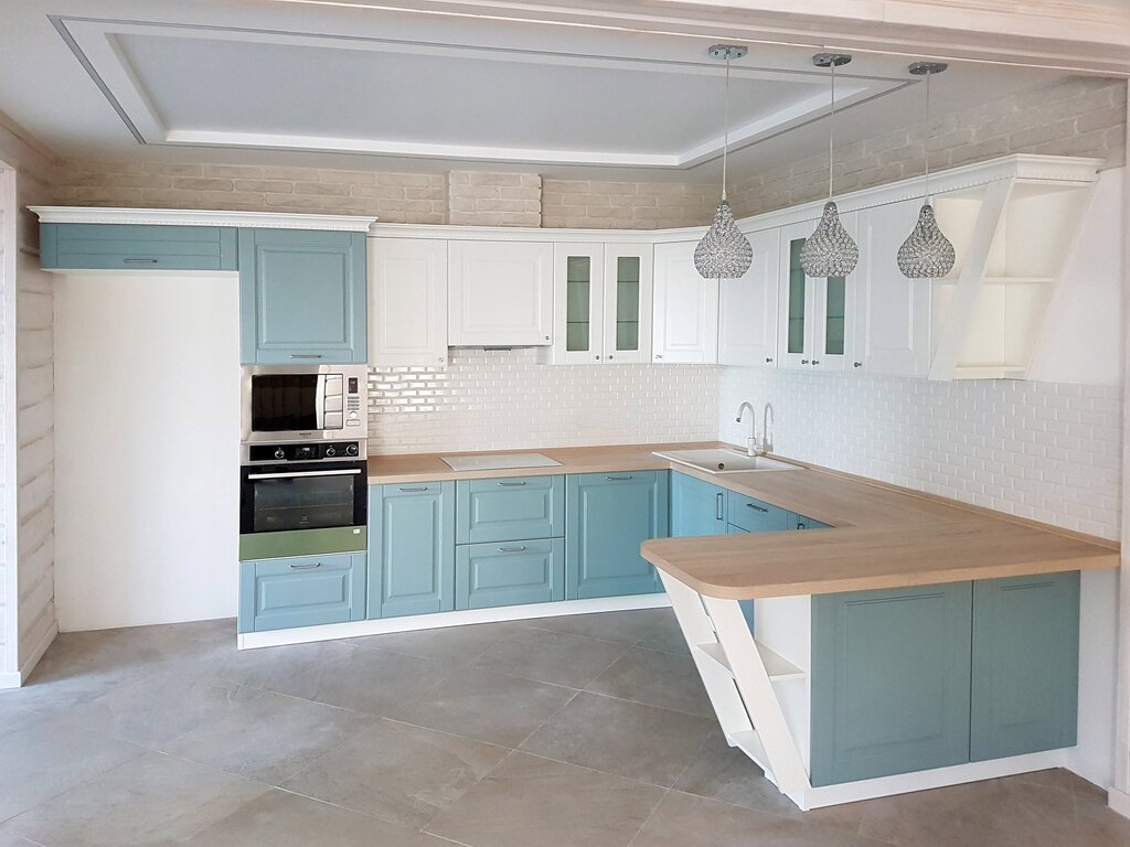 Mint kitchen with a wooden countertop