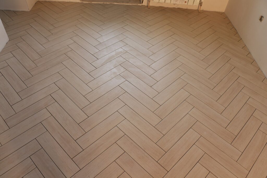 Herringbone parquet-style floor tiles