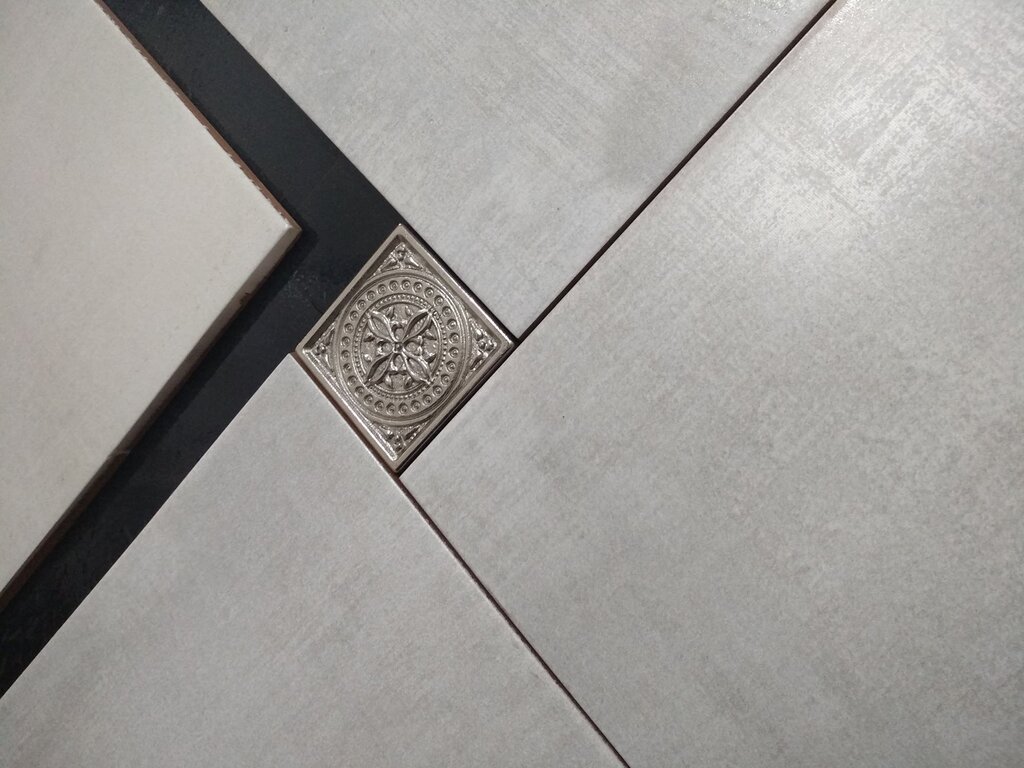 Floor tiles with inserts