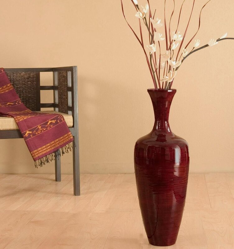 A floor vase with flowers in the interior