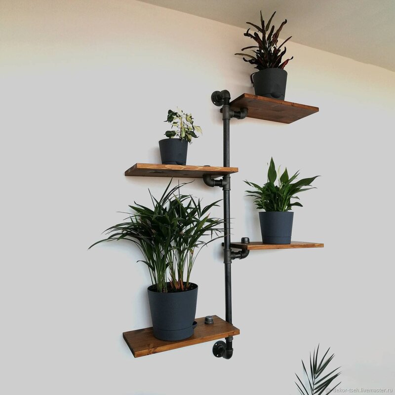 Wall-mounted wooden shelves for flowers