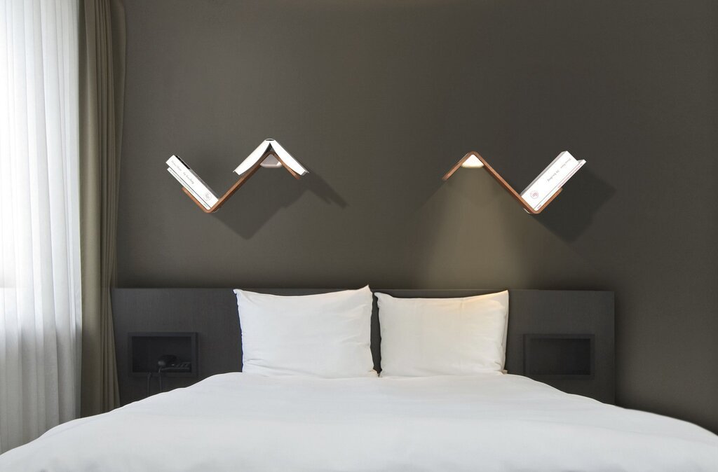 Wall lamp above the bed