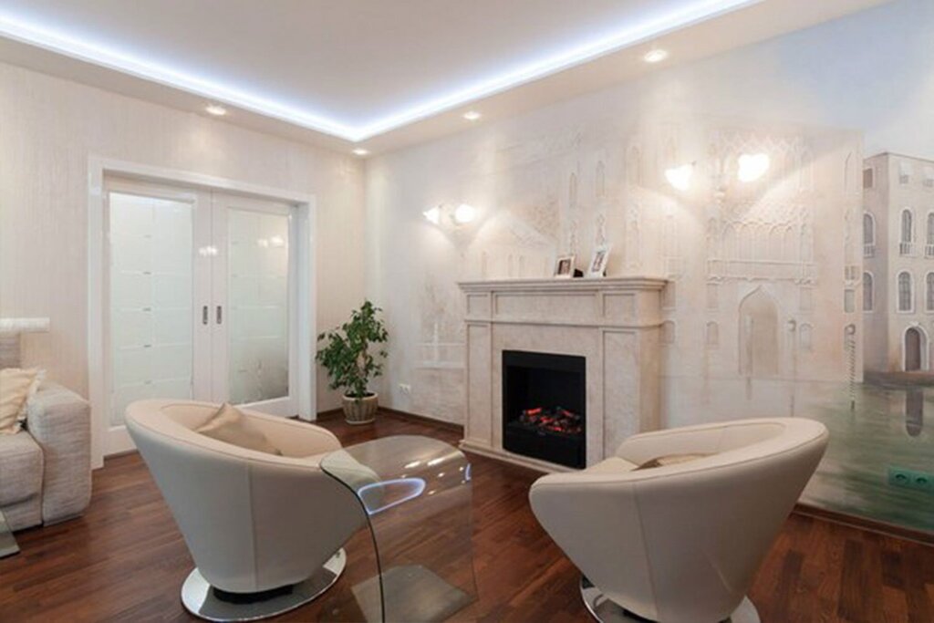 Stretch ceiling in a room with a fireplace