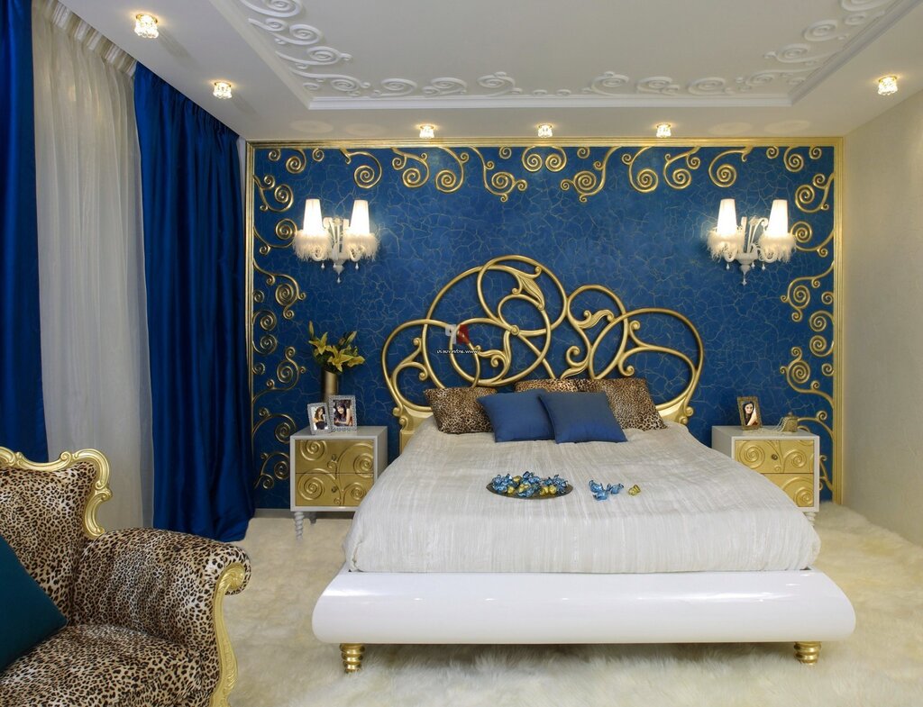 The wallpaper is blue with gold for the walls