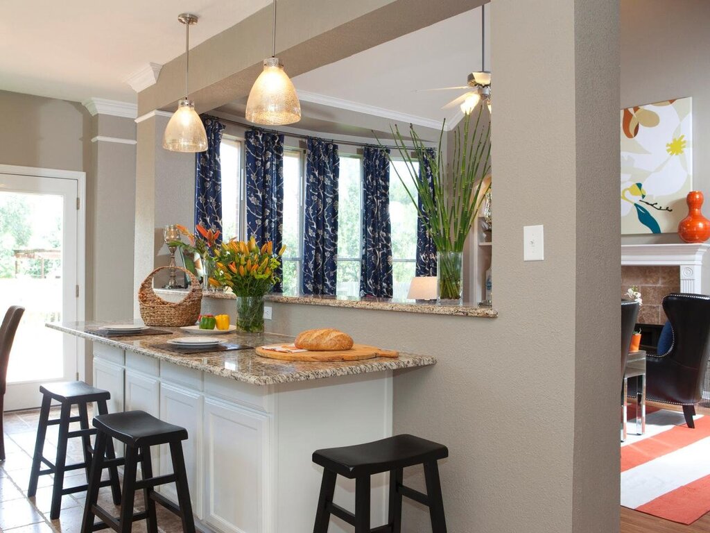 A window between the kitchen and the living room