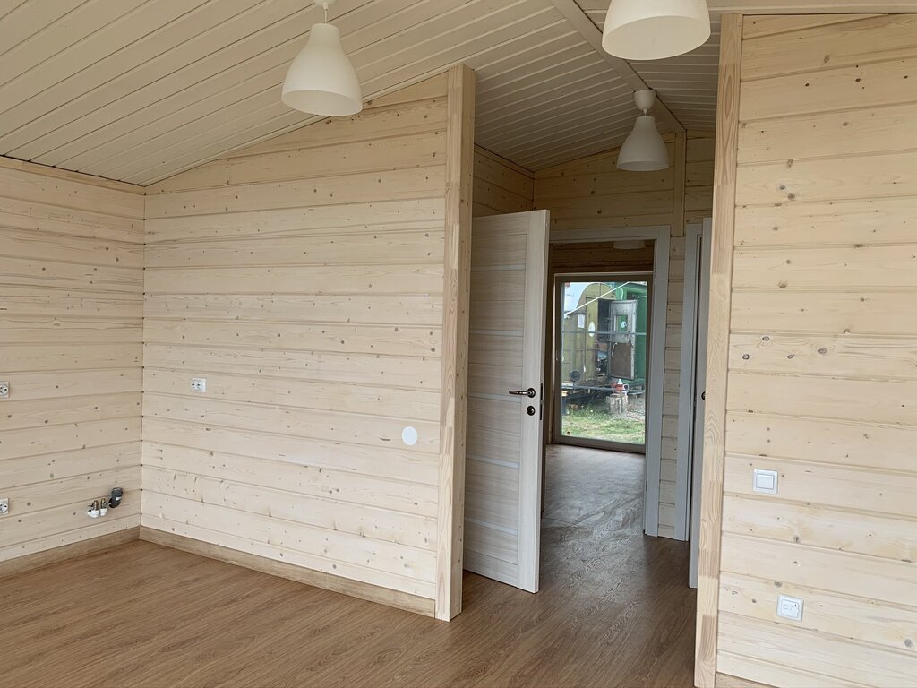 Interior finishing of a wooden house with imitation timber