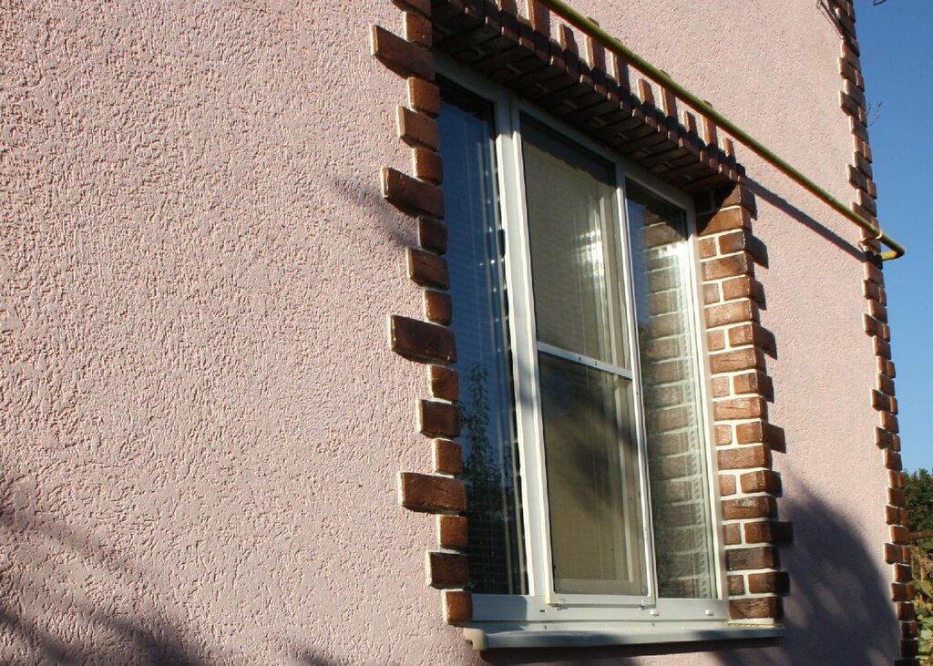 Exterior window finishing with stone