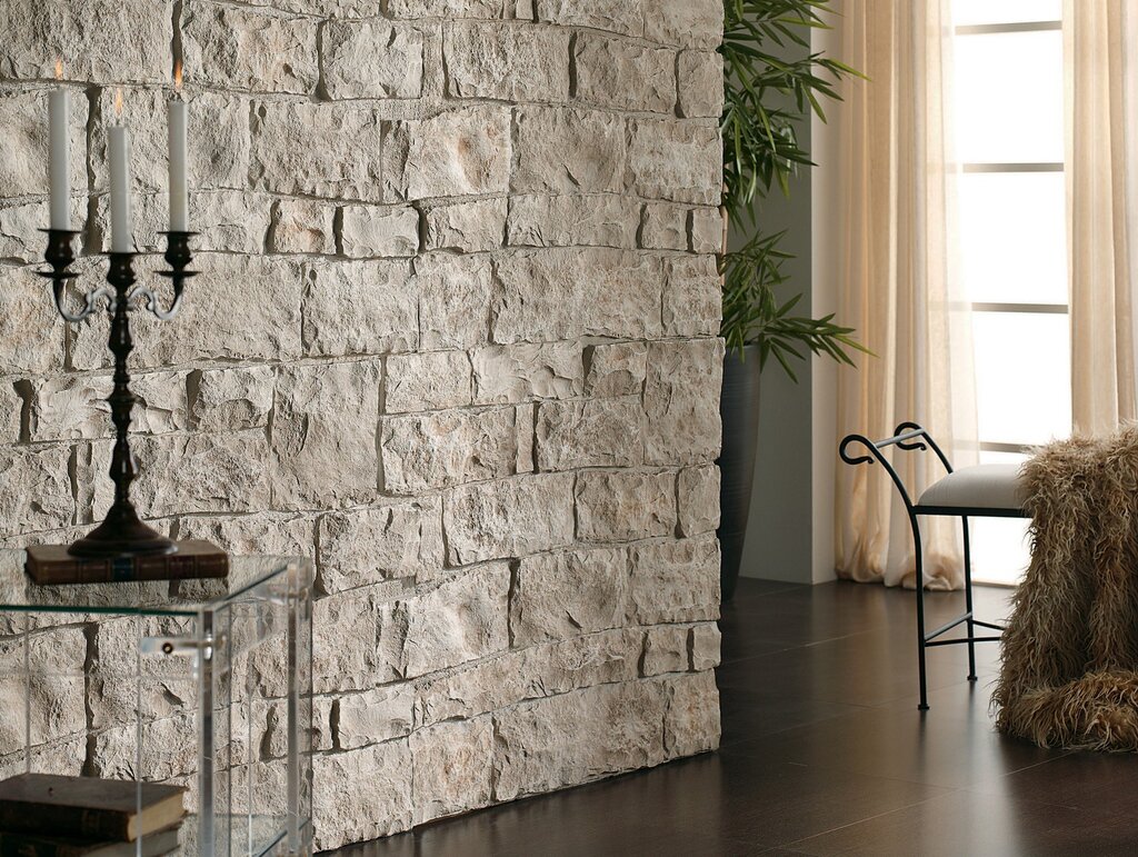 Wall finishing with plastic panels that mimic stone