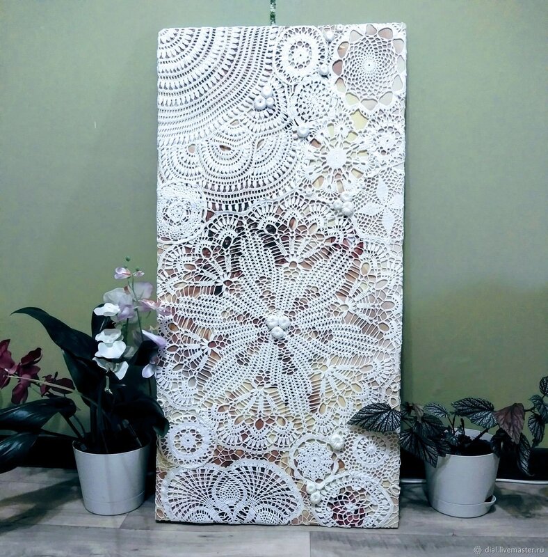 A panel made of crocheted doilies