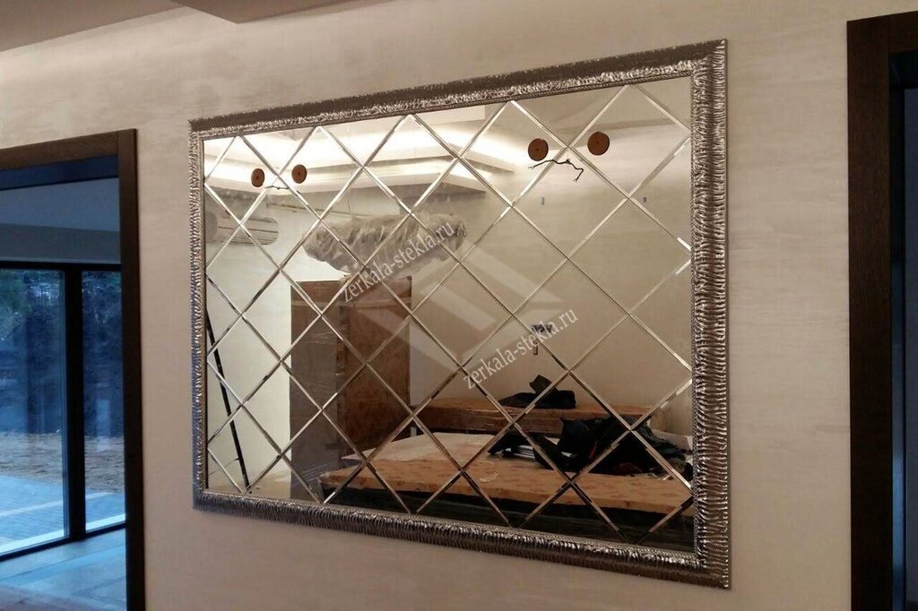 A panel of mirrored tiles in the hallway