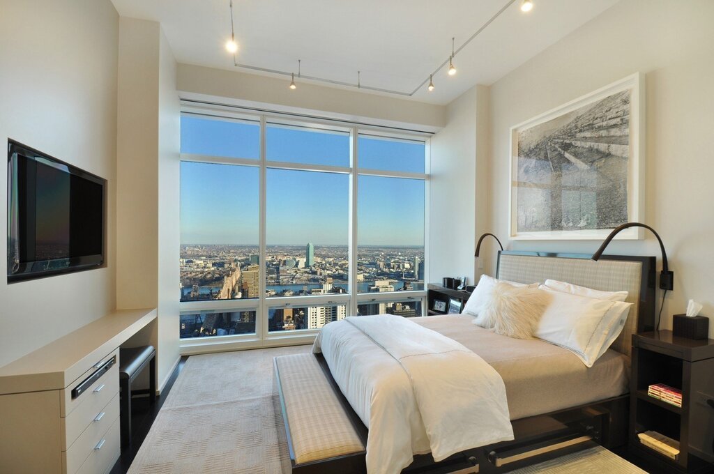 Panoramic window in a small bedroom