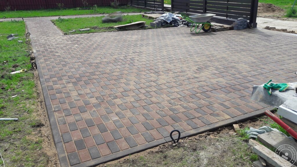 Parking at the summer house made of paving tiles