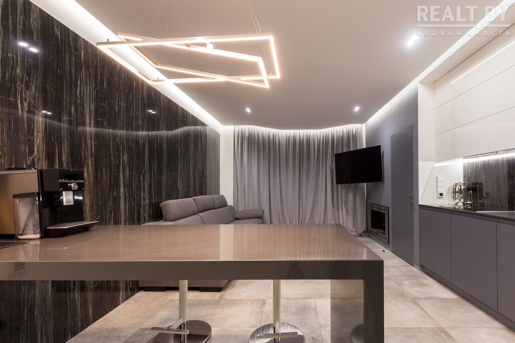 A floating ceiling with lighting in the living room