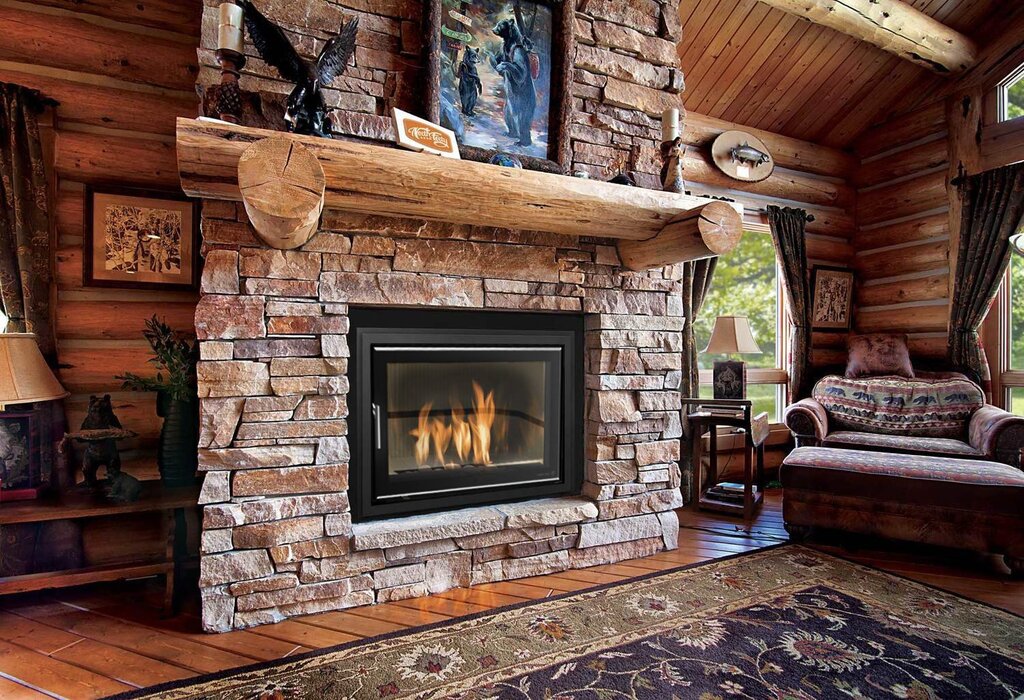 A fireplace stove in the interior of a wooden house