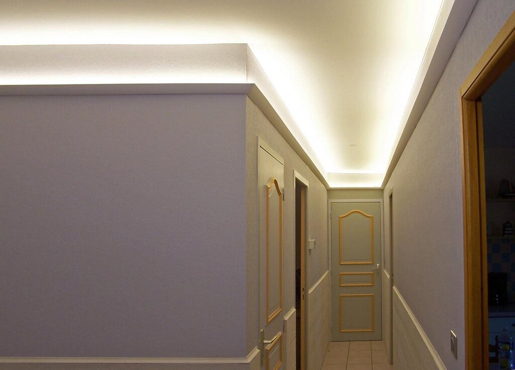 Baseboard for a stretch ceiling with lighting