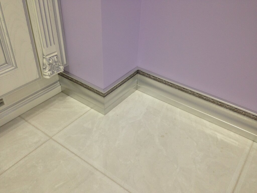 Baseboard for floor tiles